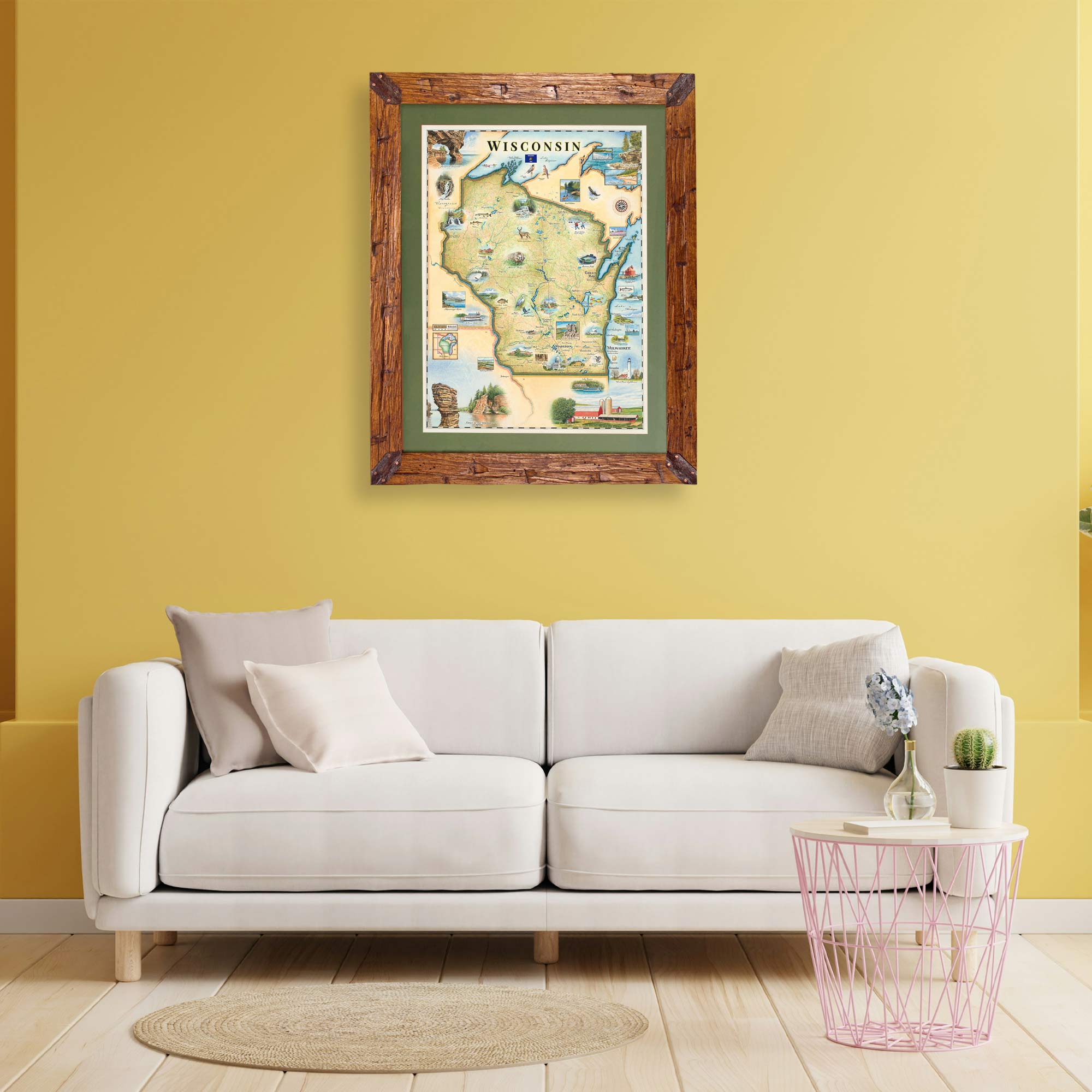 Framed map of Wisconsin on a yellow wall above a white sofa.