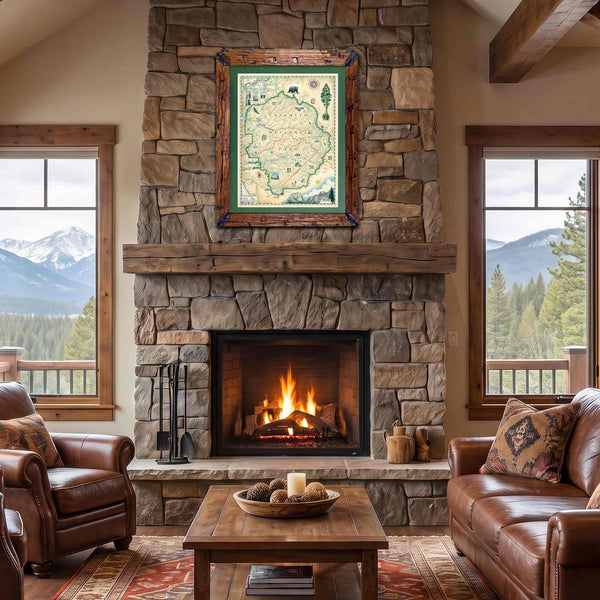 A framed vintage-style map print hangs above a stone fireplace in a rustic living room with leather sofas, a coffee table, and mountain views visible through the windows.
