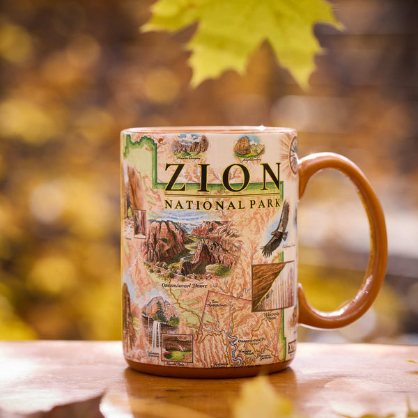 Zion National Park mug with scenic design on a wooden surface with blurred natural background