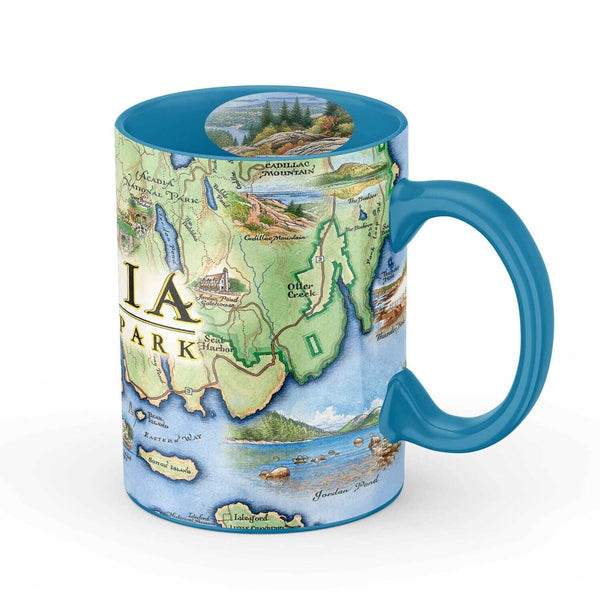 Maine's Acadia National Park Map Ceramic Mug in the color blue. The coffee cup features Cadillac Mountains, Otter Cliffs, Beaver, and Jordon Pond.