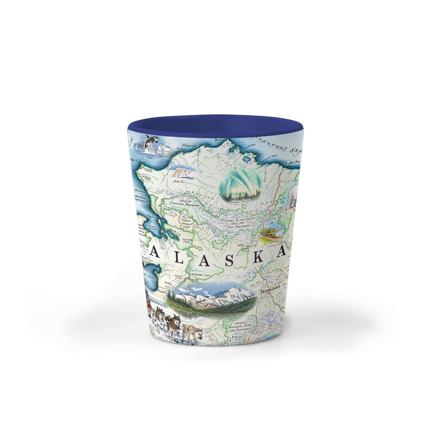 Alaska State map ceramic shot glass in earth tone colors of blues and greens. The Map features Anchorage, Juneau, Fair Banks, Denali National Park, Iditarod Trail Sled Dog Race, bears, elk, moose, whales, a mountain goat & a sheep.  