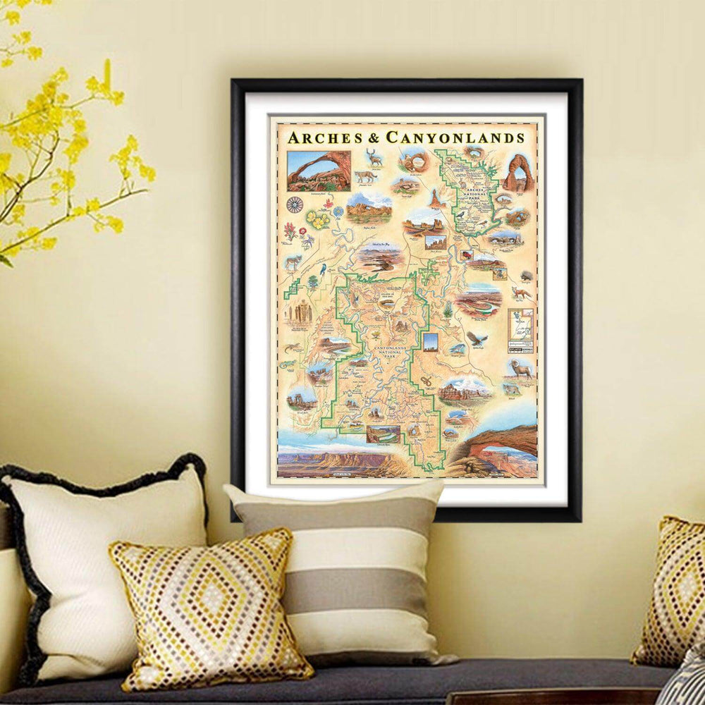 Arches & Canyonlands National Park Hand-Drawn Map haning on a tan wall above a bench with  pillows. 