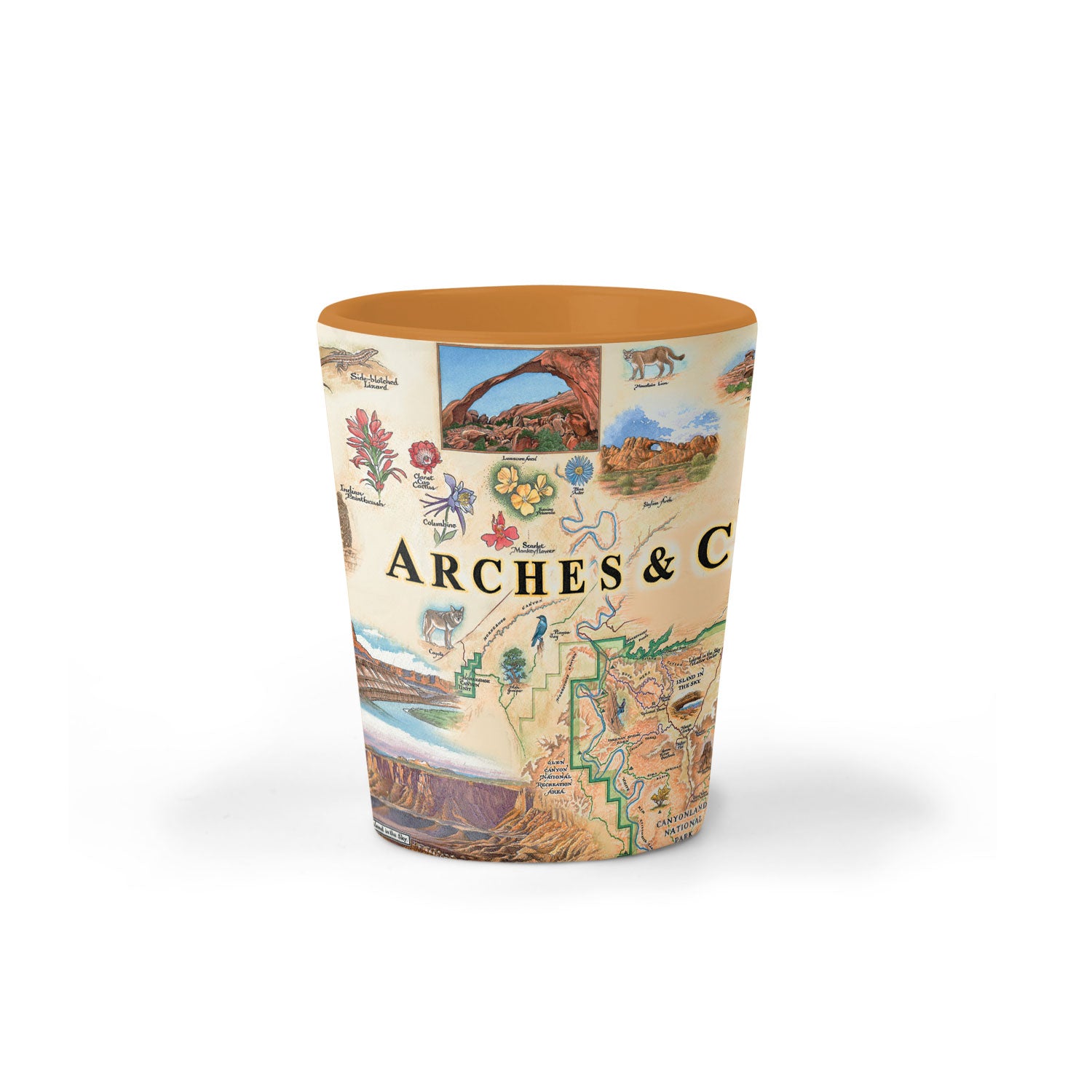Arches & Canyonlands National Parks map ceramic shot glass in earth tone colors. Arches & Canyonlands National Parks map ceramic shot glass in earth tone colors of blues and greens. The map features deer, mountain lion, porcupine, bobcats, and a fox. Landmarks are Tower Arch Delicate Arch, Double O Arch, Balanced Rock, Island in the Sky, and Fiery Furnace. 
