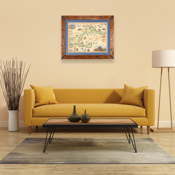 Badlands National Park hand-drawn map framed in Montana Pine with Blue mat over a yellow couch in living room.
