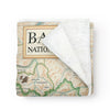 Banff National Park Map Fleece Blanket in earth-tone colors. This map highlights Lake Louise, Moraine Lake, Lake Minnewanka, Peyto Lake, Emerald Lake,  Mount Rundle, Mount Assiniboine, Cascade Mountain, Castle Mountain, Mount Temple, and Fairmont Banff Springs Hotel. Wildlife includes elk, mountain lions, Bald Eagles,  gray wolves, Bighorn Sheep, black & Grizzly bears, moose, Great Horned owls, beavers, and more. 