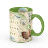 Green Black Hills National Forest Map ceramic coffee mug. Featuring Mount Rushmore, bison, elk, and flowers - 16 oz.