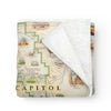 Utah's Capitol Reef National Park Map fleece blanket in earth tones. Featuring Claret Cup Cactus, Narrowleaf Yucca, Prince's Plume, and the Two-Needle Pinyon Pine. Detailed depictions of landmarks and geographic wonders like the Lower Muley Twist Canyon, Capitol Gorge, and Hickman Natural Bridge. Measures 58"x50."