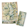 Map-themed folded paper with 'Flathead Lake' printed on it, featuring illustrations and a compass.