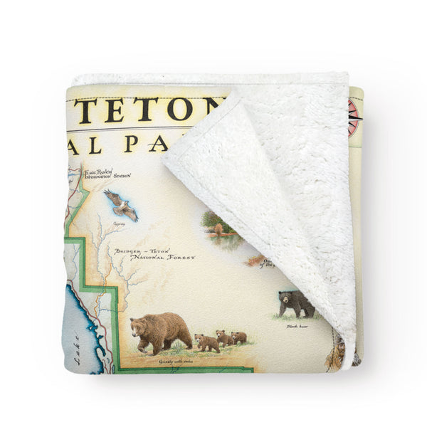 Folded, cozy blanket picturing map of Grand Teton National Park. Full color.