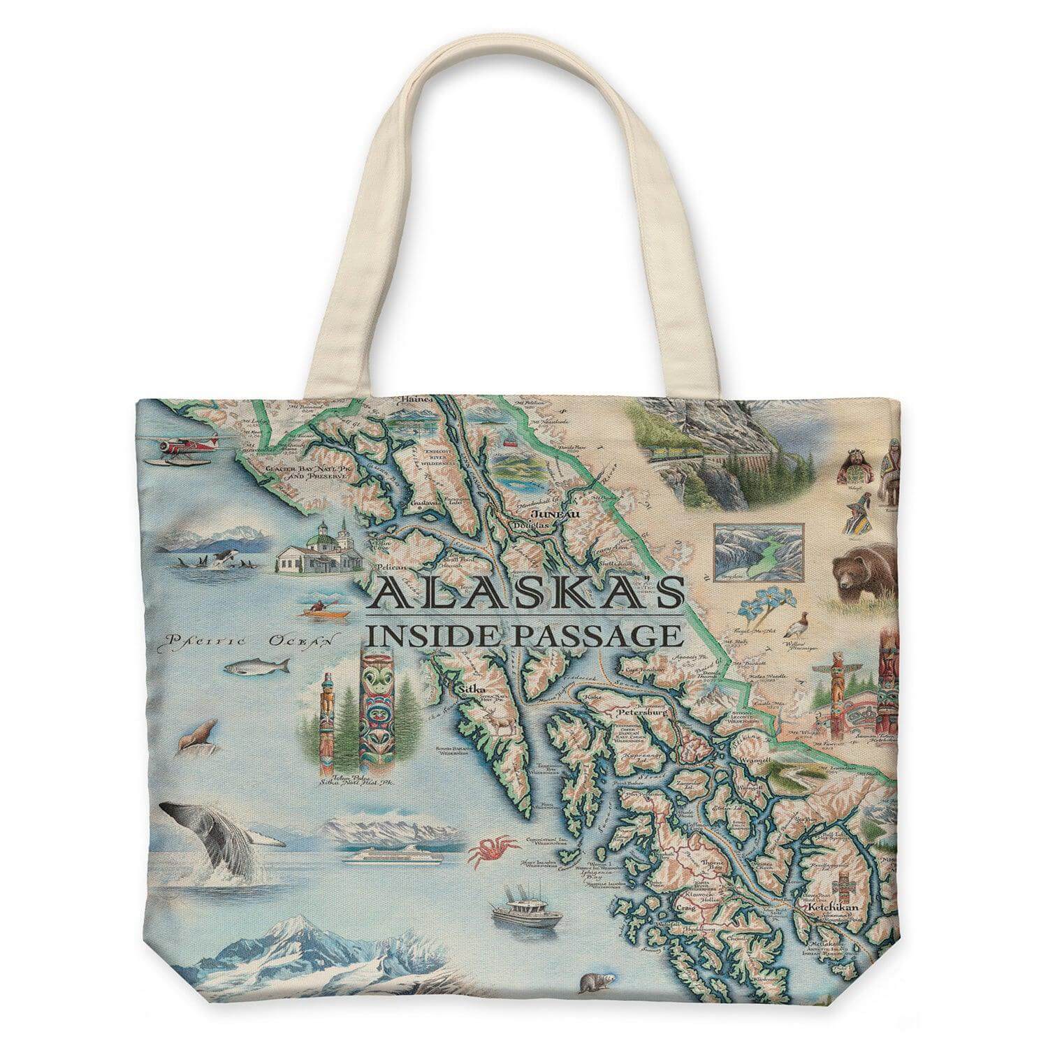 Alaska's Inside Passage Map Canvas Tote Bags by Xplorer Maps. The map features totem poles of native peoples, bears, whales, fish, mountain goats & sheep. Flora is an illustration of forget-me-nots. Including the towns of Sitka, Juneau, Ketchikan, and others.