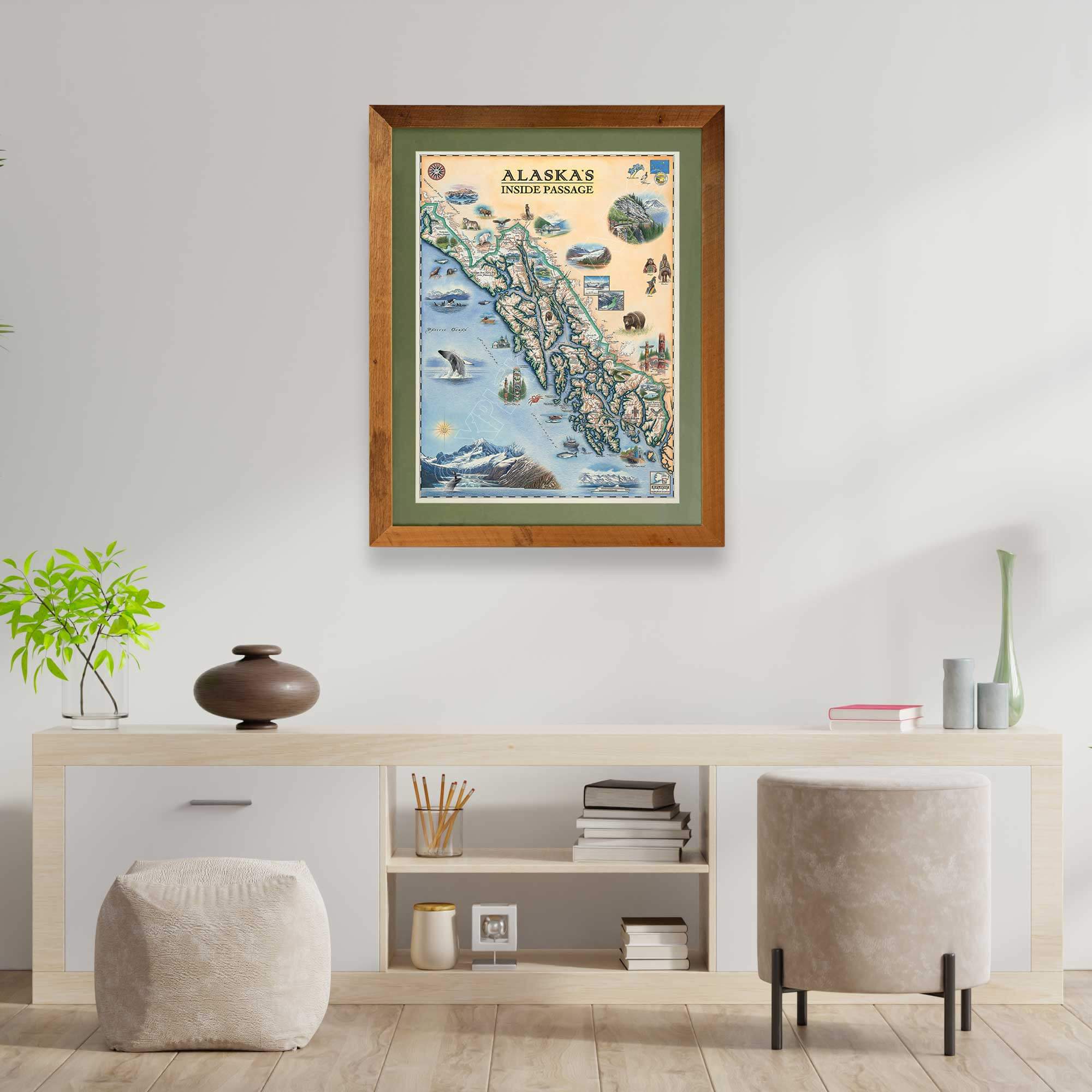 Alaska's Inside Passage Framed Map hanging on a wall above a cream colored desk with chair. 