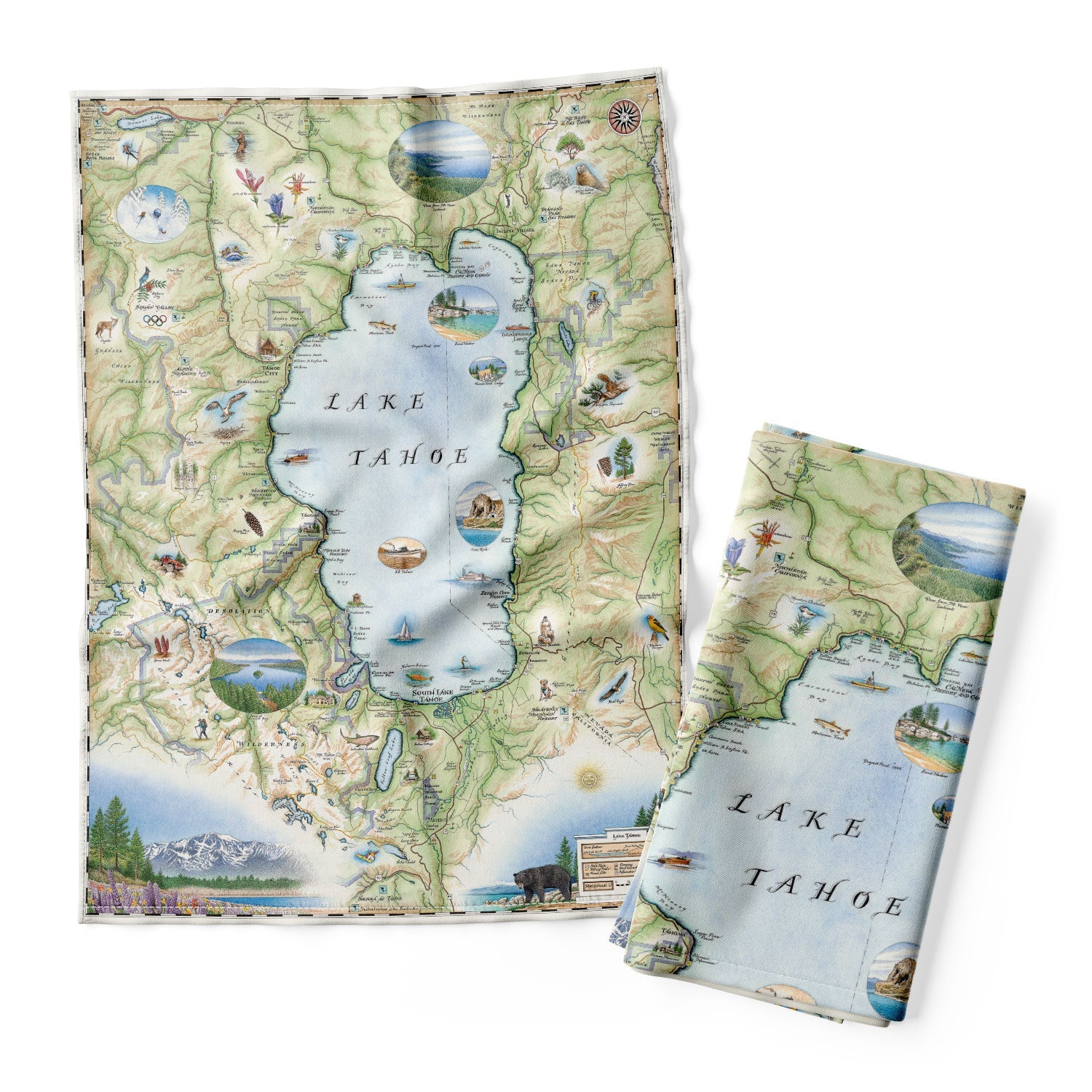 Lake Tahoe Map kitchen dishtowel in colors of greens and blues features the land's topography and the area favorites such as Emerald Bay, Cove Rock, Thunderbird Lodge, and Cal Neva Lodge & Resort. Native animals like black bears and birds with native plants are also represented on the map. 