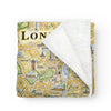 Folded blanket with a map of London on it. The blanket is a soft and cozy fleece. Full-detail map. Measures 58"x50."
