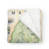 Folded blanket with a map of Maine on it. The blanket is full color and full detail. Super soft and cozy.