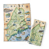 Maine State Map kitchen dishtowel featuring moose, lighthouses, fishing, lobster, ocean, boats, bears, marine life, plants, and flowers. 