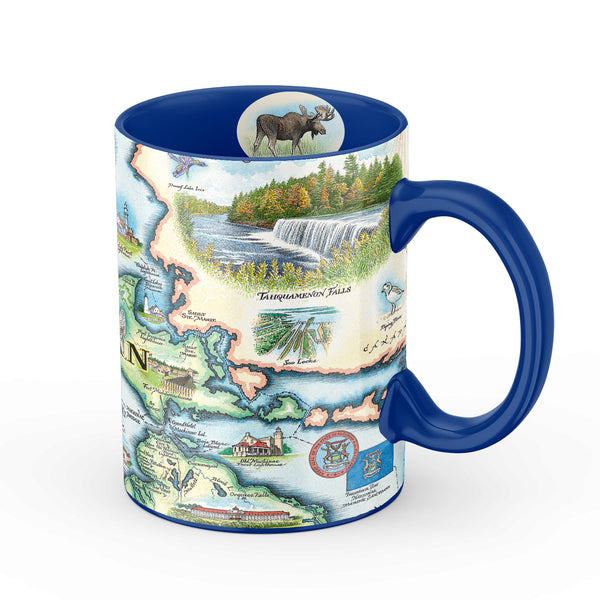 Blue 16 oz Michigan Upper Peninsula ceramic coffee mug. The cup features moose, Tahquamenon Falls State Park, waterfalls,  the Great Seal of Michigan, Thunder Bay National Marine Sanctuary, Mackinac Bridge, and an Island.