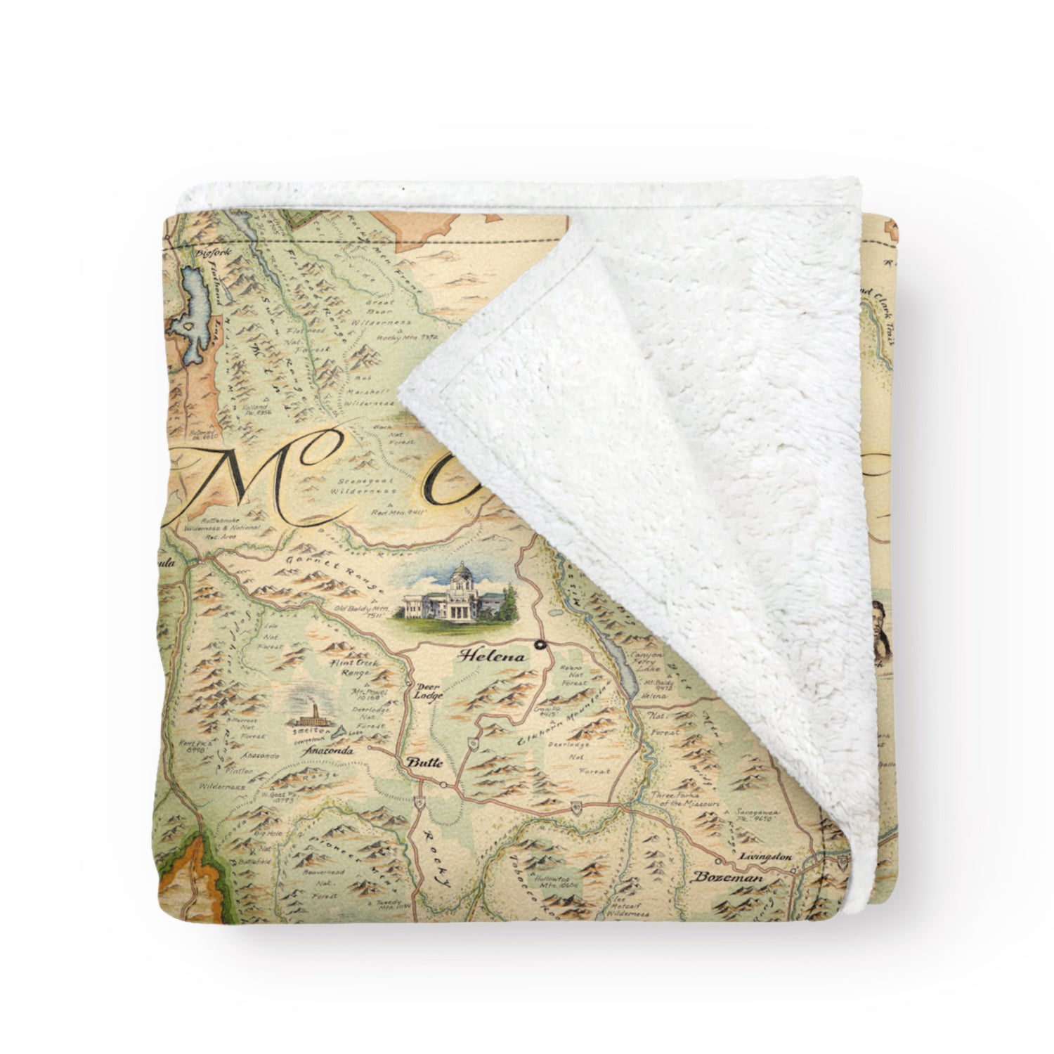 Folded fleece blanket with map of Montana on it. Blanket measures 58