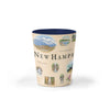 New Hampshire state map ceramic shot glass. The cup features black bears, deer, sailboats, moose, waterfalls, the Atlantic Ocean, Franconia Notch State Park, Mount Washington, fly fishing, and Crawford Notch.