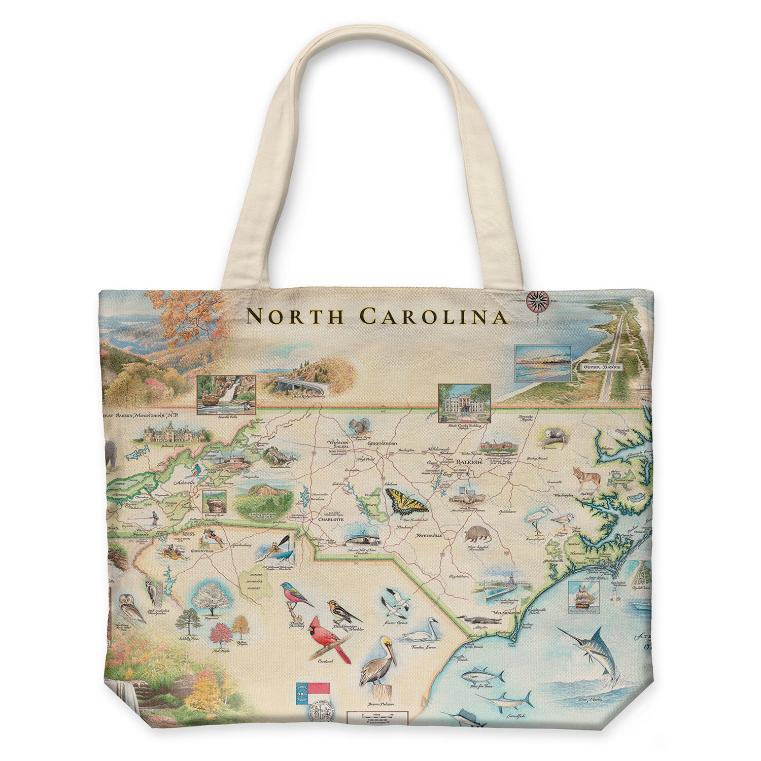 North Carolina State Map Tote Bags by Xplorer Maps. The map features Dry Falls in the Nantahala National Forest, the Outer Banks, a Nascar Hall of Fame, and the USS North Carolina on the coast.