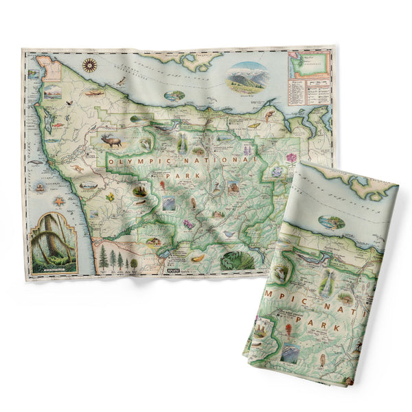 Olympic National Park Kitchen Dishwashing Towel in earth tones of blue, green, and beige. The tea towel map features illustrations of the park such as Enchanted Valley Chalet, Sol Duc Hot Springs Resort, Hurricane Ridge Visitor Center, and Kalaloch Lodge. Flora and fauna include sea otter, Roosevelt elk, Chinook salmon, skunk cabbage, and Flett's Violet.