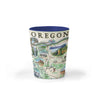 Oregon Map Ceramic shot glass by Xplorer Maps. The map features illustrations such as Hells Canyon Snake River, the Columbia River Gorge, Multnomah Falls, and Crater Lake. Flora and fauna include blue whales, big horn sheep, Dungeness crab, Oregon grape, and Douglas Fir. Some cities depicted are Portland, Hood River, Cannon Beach, and Seaside. 