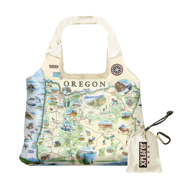Oregon State Map Pouch Tote Bags by Xplorer Maps. The map features illustrations such as Hells Canyon Snake River, the Columbia River Gorge, Multnomah Falls, and Crater Lake. Flora and fauna include blue whales, big horn sheep, Dungeness crab, Oregon grape, and Douglas Fir.