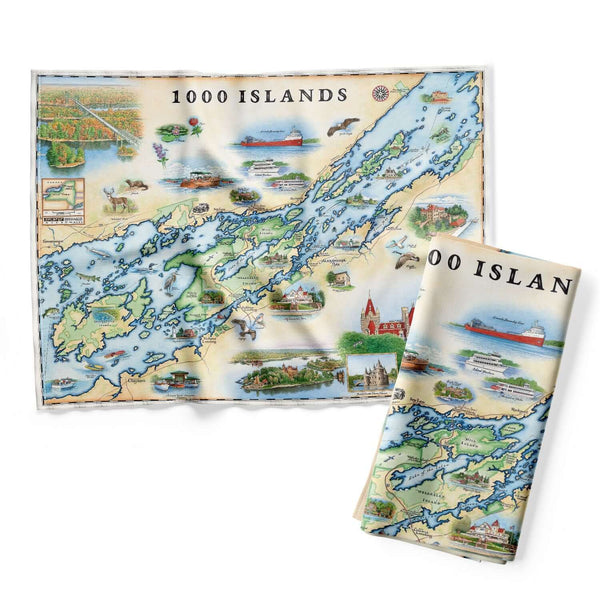 1000 Islands Map Kitchen Towels hanging over a kitchen sink. The Map features Bolt Castle, Singer Castle, Fishers Landing, Millionaires Row, Cruise ships, and Bootleggers. Flora Fauna of birds, Large Mouth Bass, and deer.