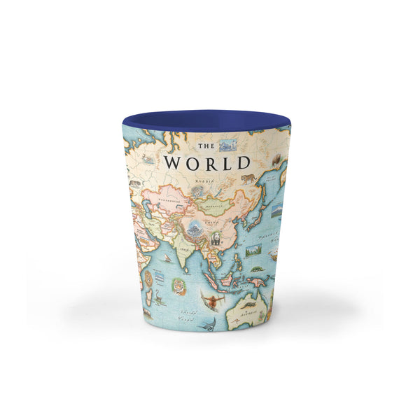 World Map Ceramic shot glass by Xplorer Maps. The map features the entire world with illustrations of significant places and major flora and fauna. Some places include Machu Pichu, the Eiffel Tower, Mount Everest, and Easter Island.