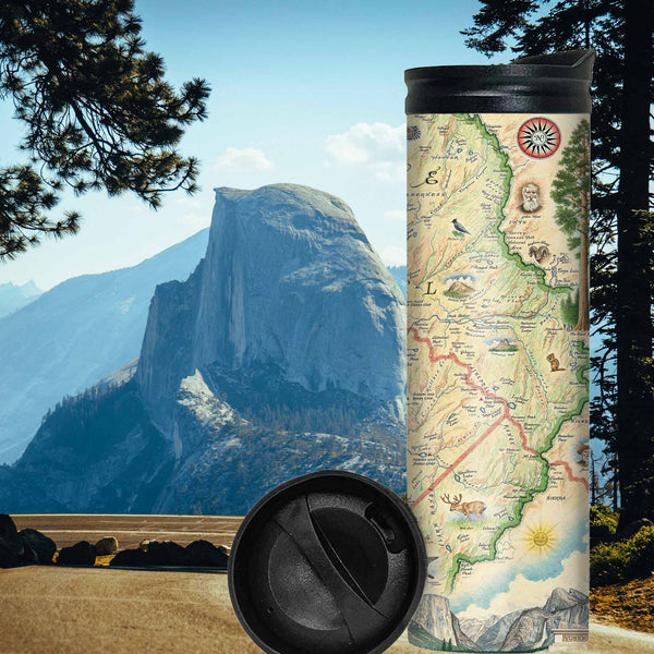Yosemite National Park Map 16 oz Travel Drinkware. In the background is Yosemite's famous Half Dome rock. The map features illustrations of places such as Vernall Falls, El Capitan, and Half Dome. Flora and fauna include mule deer, Indian paintbrush, grey owl, coyote, and a black bear with her cubs. Other illustrations include John Muir, mountain climbing, hiking, and Ansel Adams.